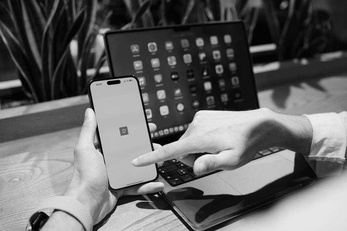 Hands using a mobile device for scanning
